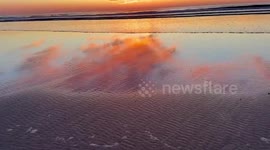 Tranquil sunset beach scene in Ogunquit, Maine