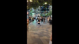 Street performers amaze crowd with acrobatic act in Kusadasi, Turkey