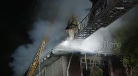 US, Los Angeles: Adams-Normandie Elderly Woman And Dog Escape House Fire