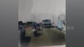 Out-of-control oil tanker ploughs into four cars on busy road