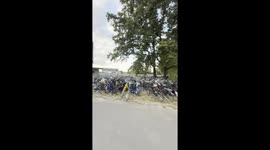 A true Dutch festival scene – hundreds of bicycles parked outside as visitors arrive by bike. Filmed on the way to a festival in the Netherlands, this clip captures the unique Dutch cycling culture in action.