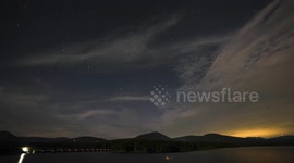 US: TIMELAPSE - Northern lights obscured by clouds over New York