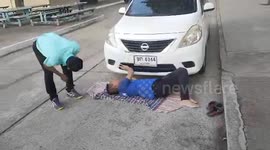 Driver rescues kitten stuck under white Nissan