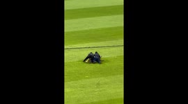 Football Fan Runs on Field at a Baseball Game