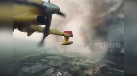 Spain: Spanish Air Force Water-Bombing Aircraft Battles Flames in Dramatic Aerial Footage