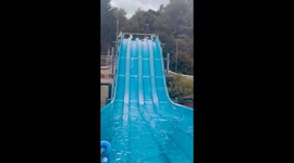 Funny water slide mishap in London, England, UK