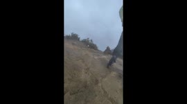 Hikers battled through violent gusts on top of country's highest mountain