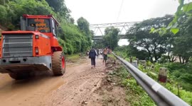 Tractors clear debris as heavy rain triggers landslides in Myanmar