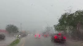 Heavy rain reduces visibility near Amelia Earhart Park in Miami, Florida, USA
