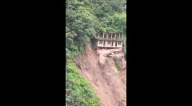 Home crashes down notorious hillside as earth gives way in India