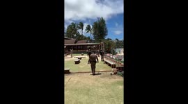 Police remove tourists ignoring red warning flags from sea in Thailand