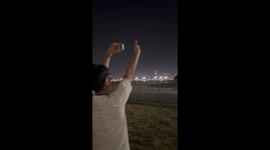 Pilot waves to plane spotter while parking at airport