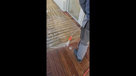 Satisfying power washing process employed to clean wooden floor