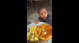 Toddler sneaks pancake in Henderson, Texas