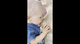 Breastfeeding Baby Gets Bamboozled By Statue