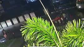 Truck carrying straw topples over onto car narrowly avoiding family