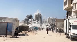 Israeli forces level high-rise building in Gaza City, defense minister says
