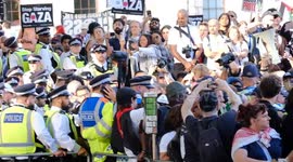 Police forced to pass through angry crowd as hundreds of arrests made at Palestine Action proscription protest in Parliament Square