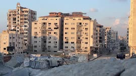 MOMENT - Israeli army bombs another high-rise building in Gaza City