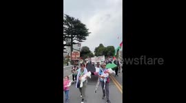 Canada: Carrying baby shrouds to symbolize slain children in Gaza, activists marched in British Columbia, Canada, to say no to the war against the Palestinian people