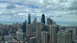 Timelapse of moving clouds and glowing skies over downtown Chicago, Illinois, USA