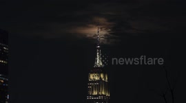 Full Blood Moon rises behind Empire State Building in New York