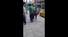 Taxi driver and motorcyclist trade blows in traffic after foot-crushing incident