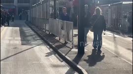 people line up for packed buses at Victoria station due to London tube strikes.