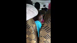 Baby’s curious stare inside vehicle in Kampala, Uganda