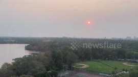 Sunrise through haze in Cambridge, Massachusetts, USA