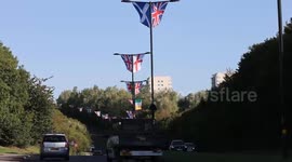 Group use cherry picker to erect over 40 UK flags on lampposts along entire street