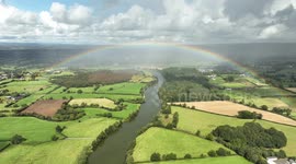 Drone view of Rainbow Over Blue-Green Algae infested River Bann