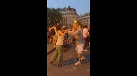 Couple Performs an Impressive Lift at Music Festival