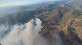 Spain: Helicopter Footage Captures Wildfire Threatening Castromil Before Containment