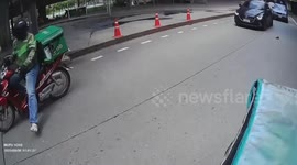 Hero motorcycle rider saves stray kitten on road