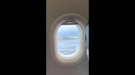 Plane slides off runway while landing during typhoon in Hong Kong