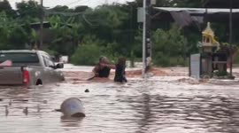 Child rescued from floods as heavy rain lashes northeast Thailand