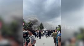 Smoke, flames rise as protestors march against government in Nepal