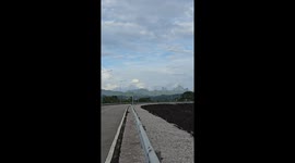 Jogger trips on road barrier while recording his workout