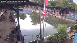 Angry monkey chases fisherman forcing him to jump into pond