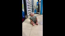 Sleepy toddler snacks while fighting drowsiness in Depok, Indonesia