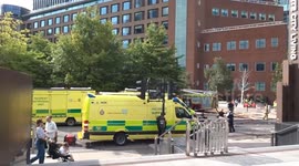 NHS incident support vehicles on Wood Lane with BBC former TV Centre fire investigation underway