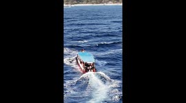 Ferry with tourists onboard battles through choppy sea