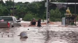 Child rescued from floods as heavy rain lashes northeast Thailand