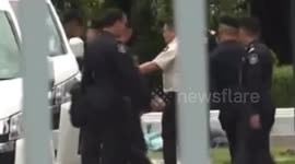Former Thai PM bundled into police van to start prison sentence