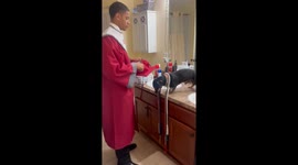 Old Dachshund Helps Prepare for Graduation Day