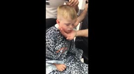 Hillarious toddler falls asleep at barbers