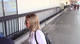 American Talk show host Kelly Ripa is spotted as she walks through LAX Airport in Los Angeles, Ca with her sons