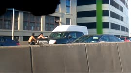 Men ride bicycles the wrong way up a highway in New York