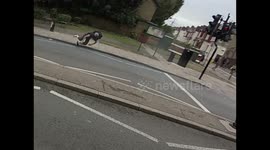 Motorcyclist doing wheelie overdoes it and comes off.